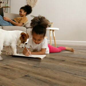 Teenaged girl and her little sister at home | Pierce Flooring